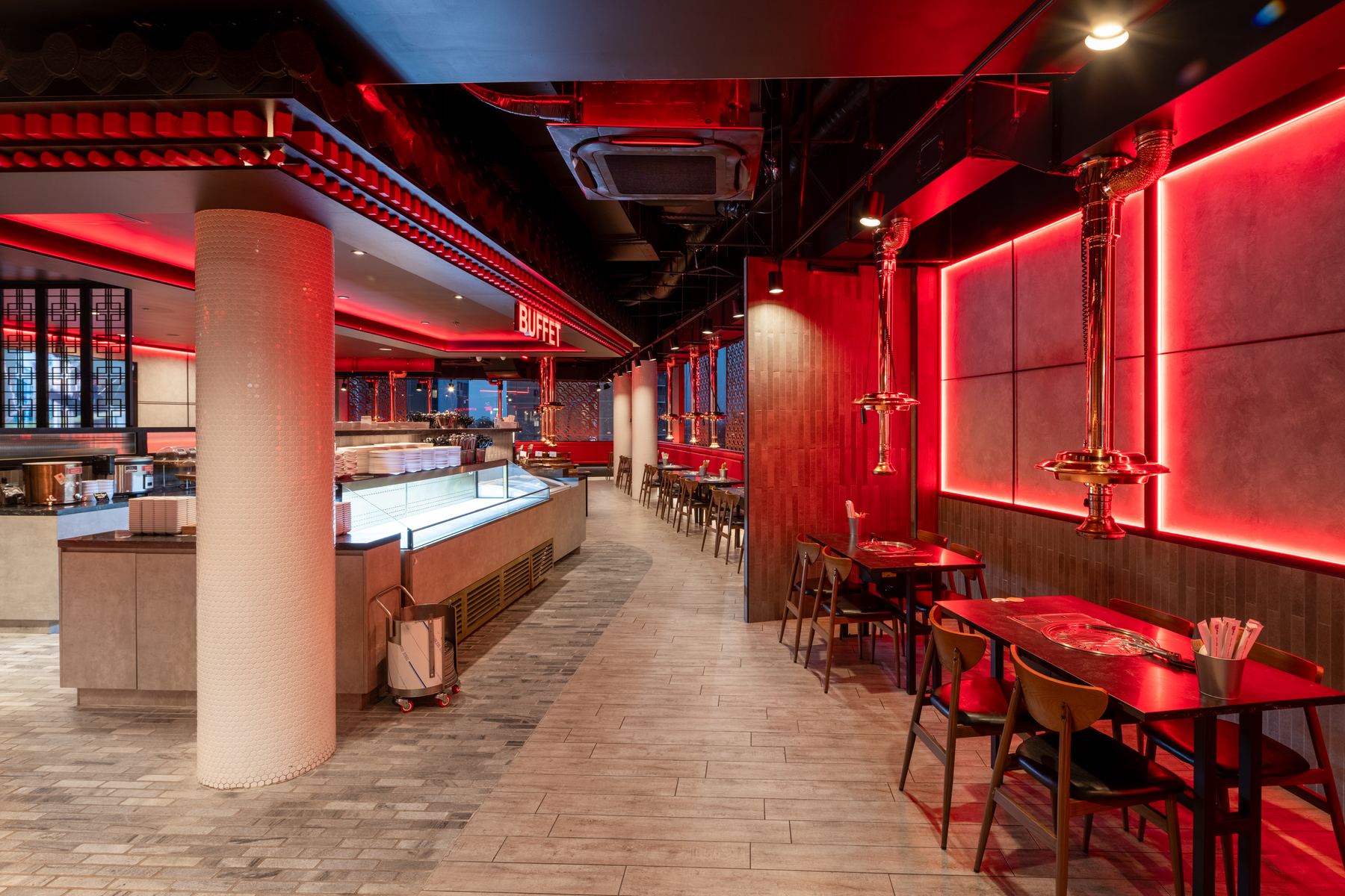 Buffet aisle with tiled column and red-lit wall panels